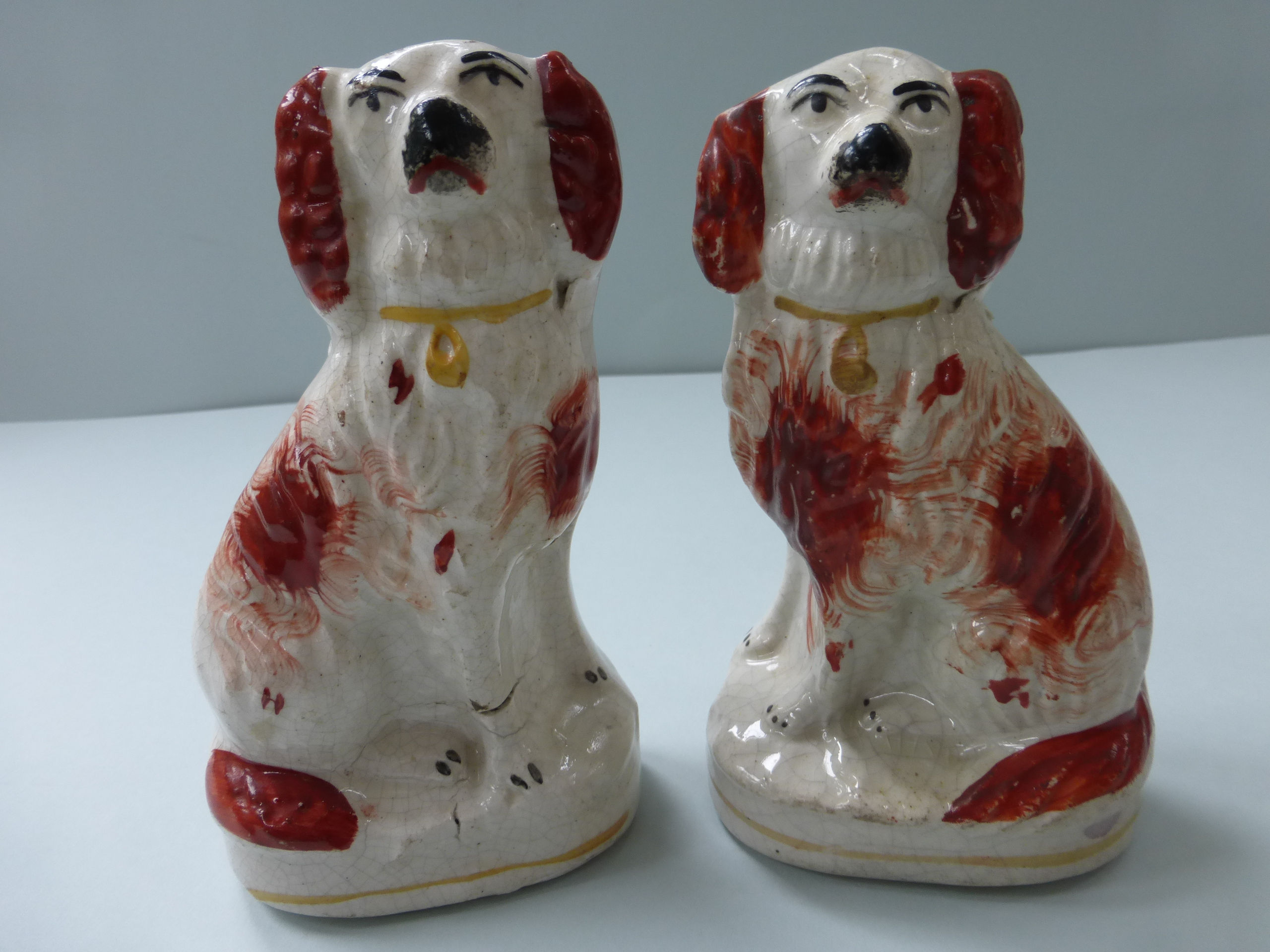 PAIR SMALL 19THC. STAFFORDSHIRE RED AND WHITE SPANIELS