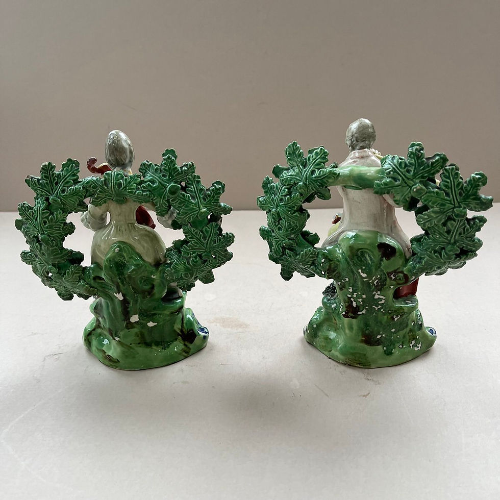 Thumbnail: A pair 19thc. Pearlware Staffordshire of seated Musicians Ref # 5068