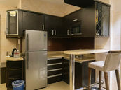 Prime Asia Hotel Luxurious suite room with king-size bed and ensuite bathroom
Presidential Suite