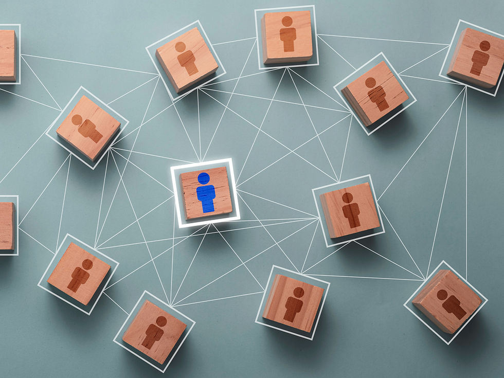 Wooden blocks with person icons are linked by white lines on a blue background. One block has a blue icon, emphasizing connection.
