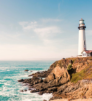 lighthouse in mountain next to ocean_edi