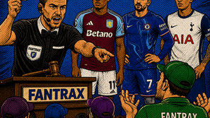 Fantasy soccer auction referee raises yellow card while managers watch players behind him; FANTRAX signs on podium and shirts.