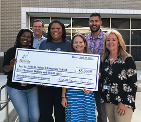 Elementary School staff receiving a donation check from Birdville Education Foundation