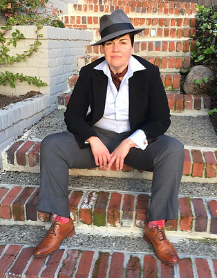 Client Tootsie looking dapper in a porkpie hat and suit.