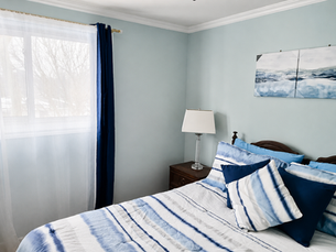 a modern bedroom recently painted grey blue