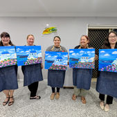 step-by-step guided painting class, paint and sip, painting party of a scene of the Greek Santorini island with vibrant pink bougainvillea in the foreground 