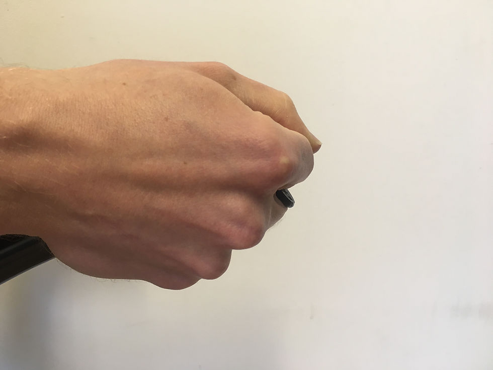 Thumbnail: Hand gripping Ward Performance track Aerobar extension Finger Lock Plug with index finger on top