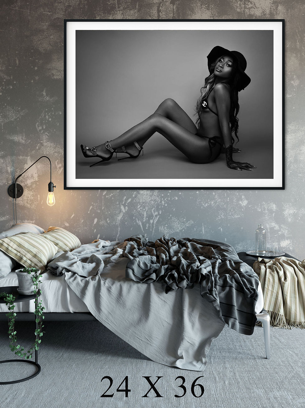 Beautiful woman featured in black and white in a picture on the bedroom wall.