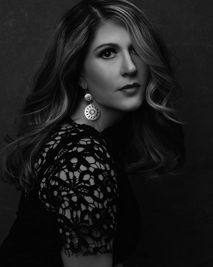 She looks straight at the camera regally, black and white showing her as you may have seen powerful women of the past.