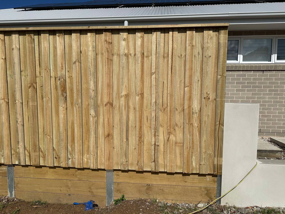 Neat and durable lap and cap fence built in Gables