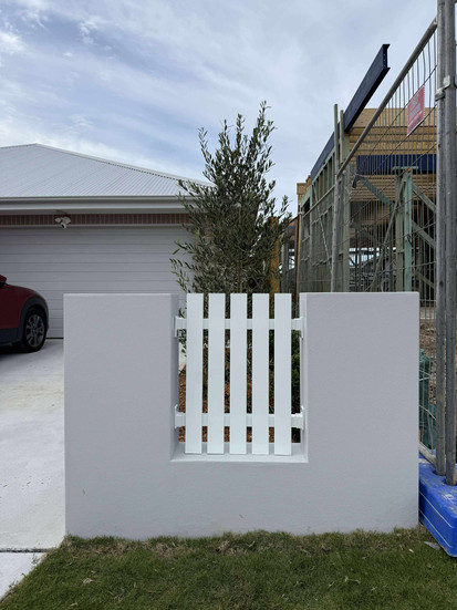 Custom aluminium fence installed on rendered brick piers