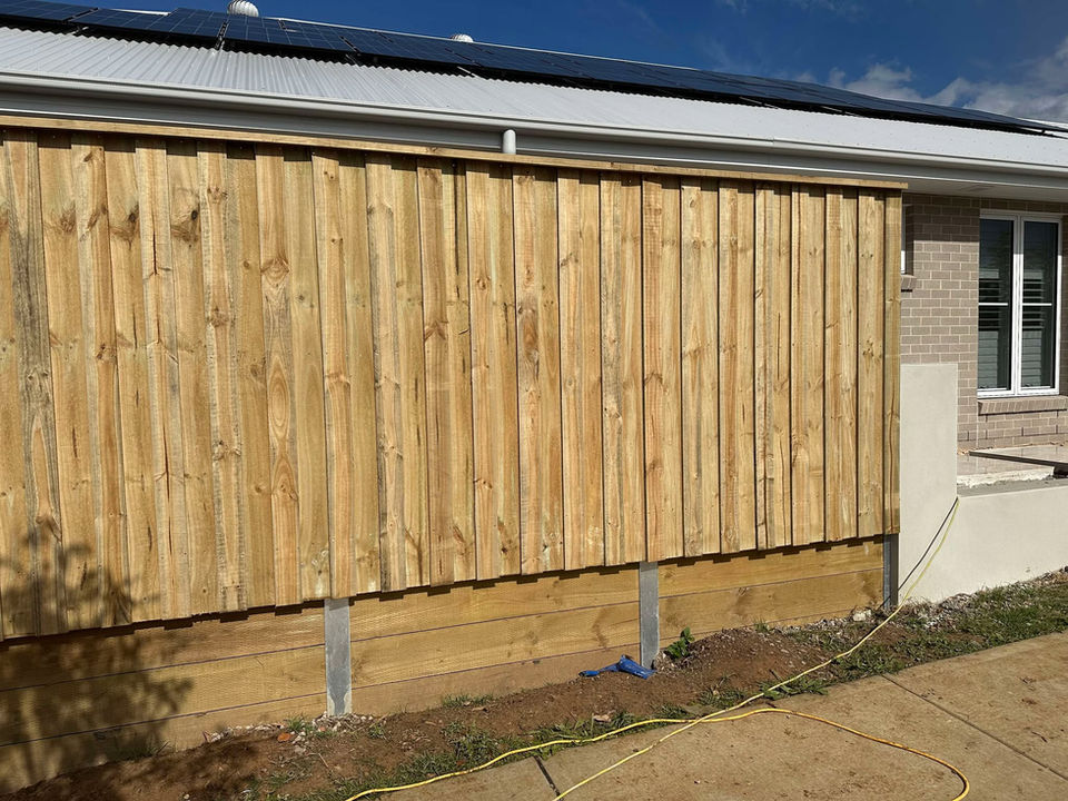 Treated timber fence with capping rail in Gables