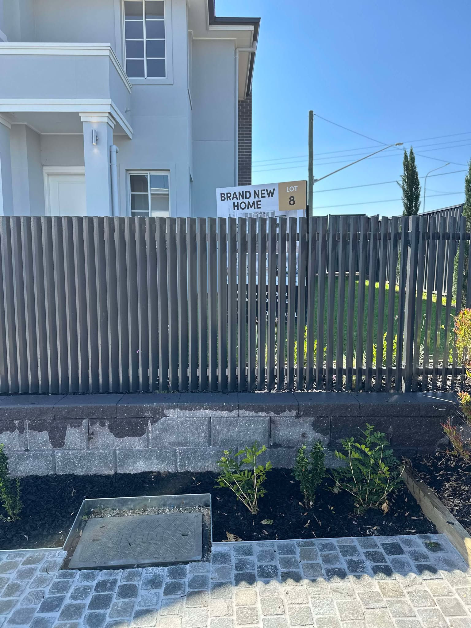 durable & Stylish Privacy Fencing - Close-up of modern blade fencing showing sleek vertical timber slats