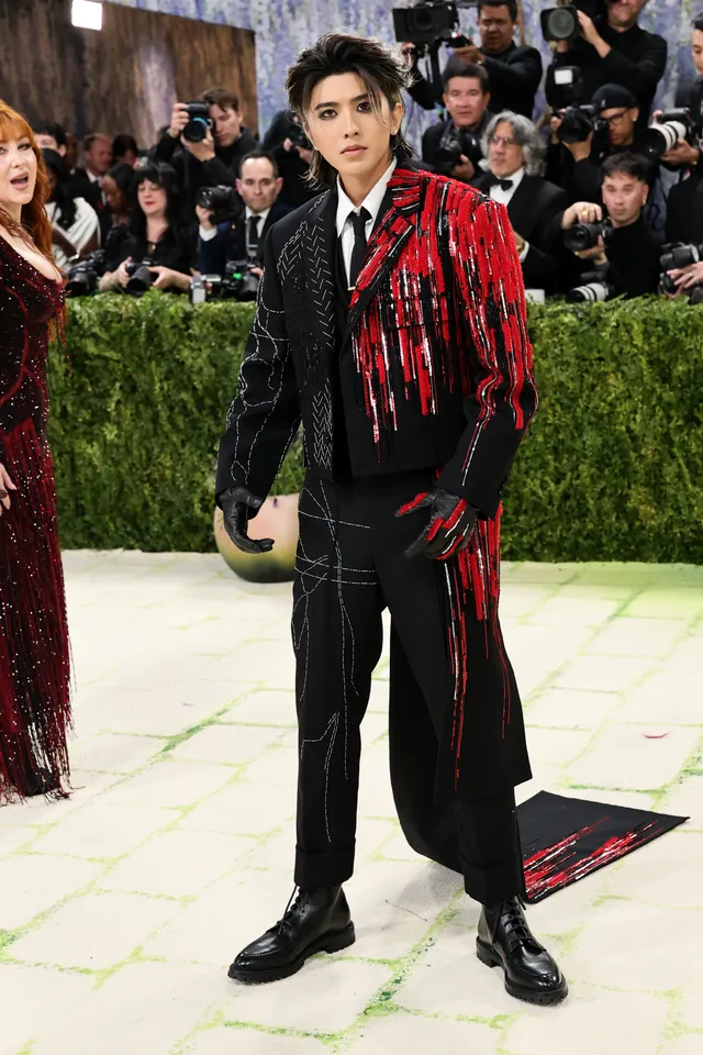 Kun in Thom Browne [Photo Courtesy: Getty Images]