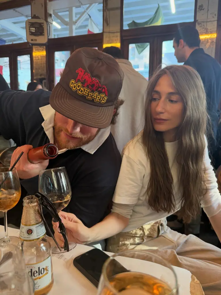 Wilson pouring a drink for Batula [via Amanda Batu;a on Instagram]