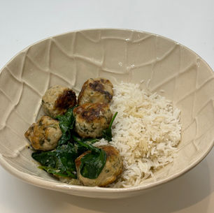 Thai chicken meatballs with coconut milk and fresh spinach
