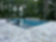 The installation of a Gunite Pool Deck , with a Travertine Pool Deck, and a travertine coping.