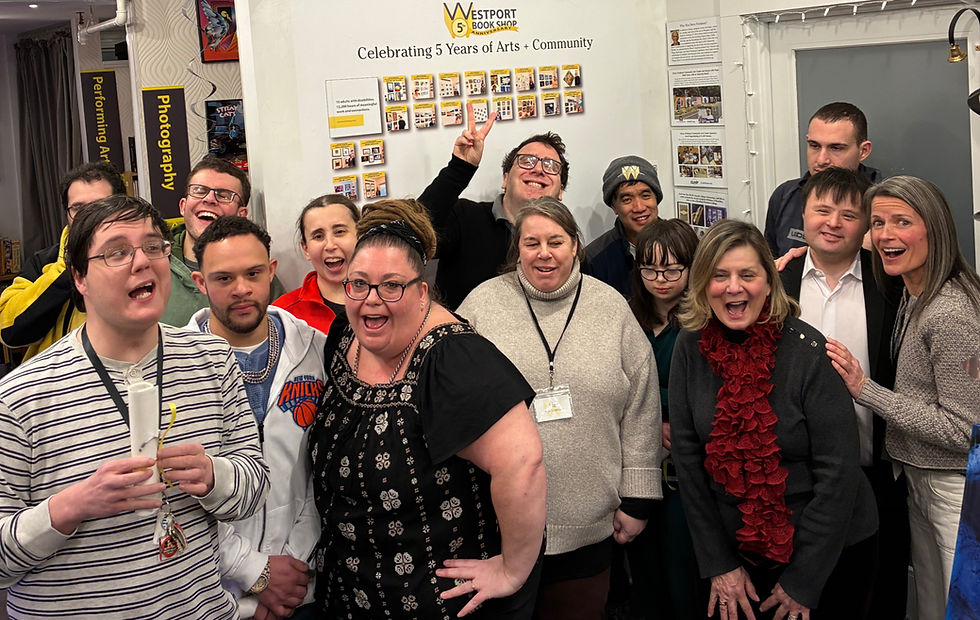 Image of a grouop of people laughing and posing