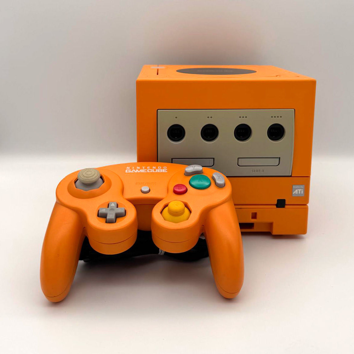 Spice Orange Nintendo GameCube with matching controller front view