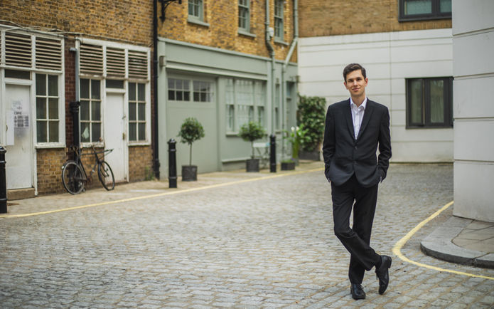 Jamie standing in a Georgian mews and smiling at the camera