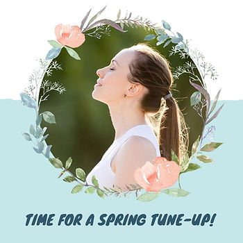Woman framed by spring flowers with a spring tune-up message.