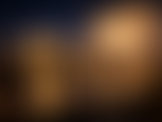 Two champagne glasses on a rooftop table overlooking a city skyline with fireworks, symbolizing leadership vision, celebration of achievement, and setting bold goals for the new year.