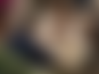 Two professionals having a warm, face-to-face conversation over coffee on an outdoor patio, demonstrating connection, active listening, and building strong relationships in a leadership context.