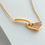 Thumbnail: Minimalist gold heart necklace with pavé zirconia on ivory satin background – elegant and soft close-up.