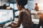 Real photo of African american female from behind Doing Graphic design on the computer.jpg
