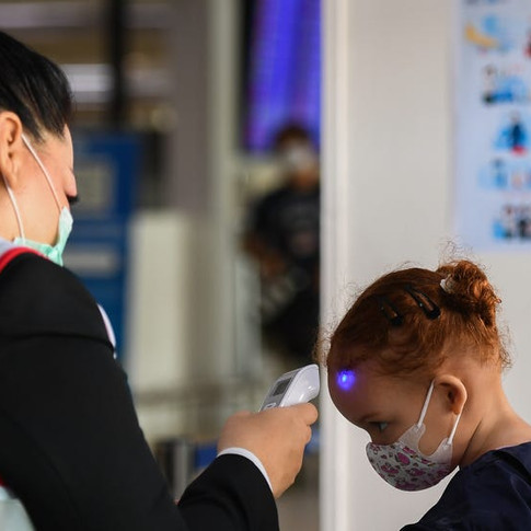 Temperature checks being done at airports on children 
