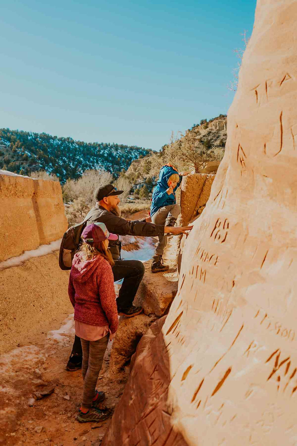 Kids climbing at the Dragon outside Kanab, Utah