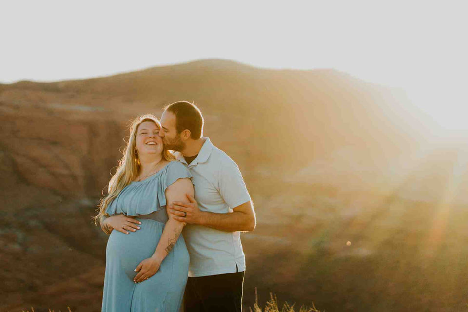Maternity photos in Snow Canyon State Park at the sun sets