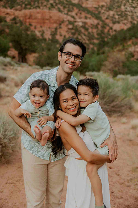 Family photoshoot in Zion National Park with towering red rock backdrop