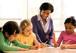 photodune-422704-teacher-helping-student