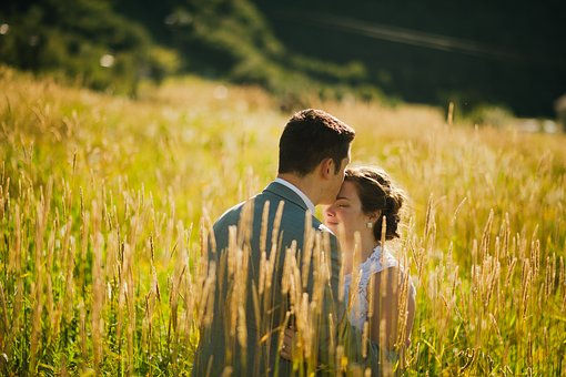 Newly wed couple in a wildflower meadow