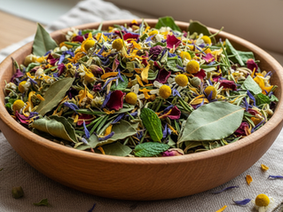 Close-up view of dried herbal leaves and flowers in a wooden bowl