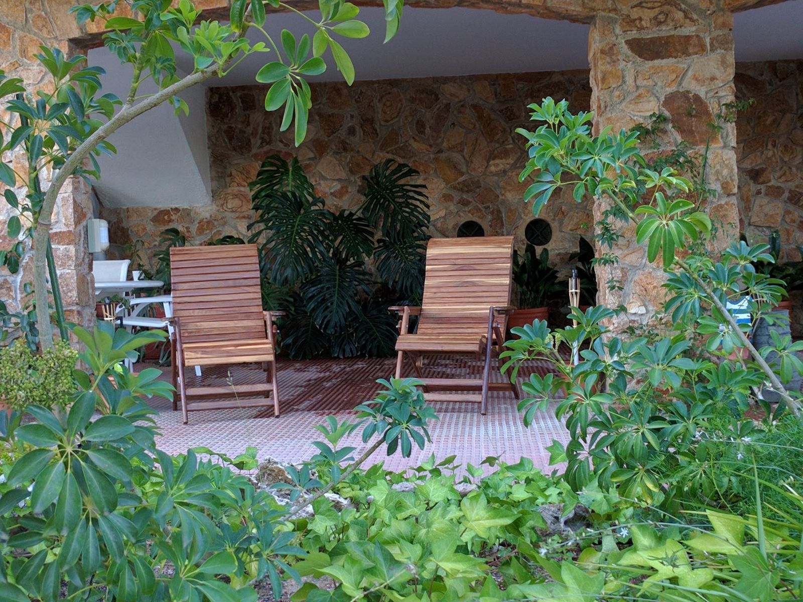 Teka chairs in a garden.jpg
