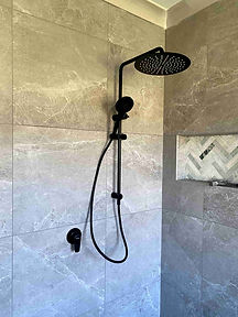 Modern bathroom renovation Sydney with walk-in shower and stone tiles
