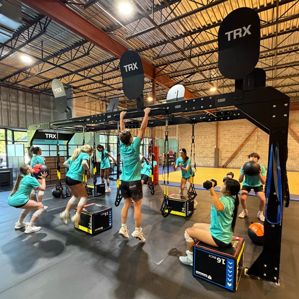 A group of volleyball players running through a High-Intensity Interval Training bootcamp.