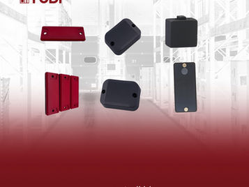 Black and red Hard Tag RFID on a warehouse background. Red gradient on the left with "TUDI" logo. Website text: www.tudi.id.