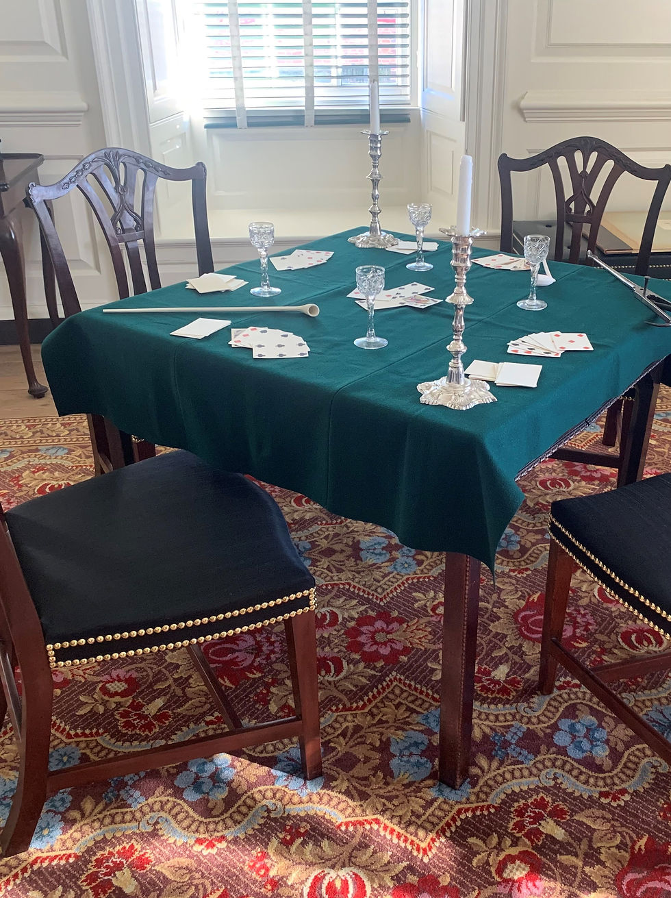 table in colonial house with poker cards lying on it