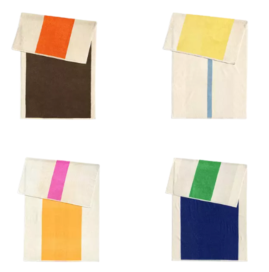 Four folded towels with color blocks. Top left: orange/brown. Top right: yellow/blue. Bottom left: pink/orange. Bottom right: green/blue.