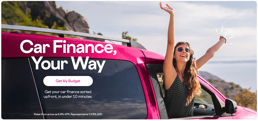 Woman in sunglasses joyfully raises arms through a pink car's window. Text: "Car Finance, Your Way". Background: scenic cliffs.