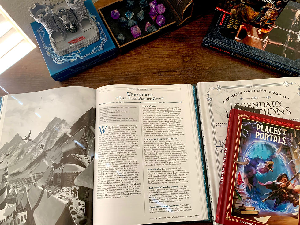 The Game Master's Book of Instant Towns and Cities book open to a page, on a wooden table with the other reviewed books in the foreground and a mini dice tower in the background next to a dark dice tower with dice in the tray.