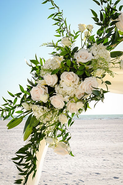 White arch flowers - beach wedding