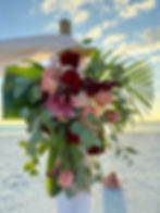 Sunset wedding flowers tropical