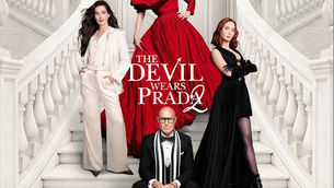 Three fashion models and a seated man on white staircase, with a woman in red at centre; title The Devil Wears Prada 2