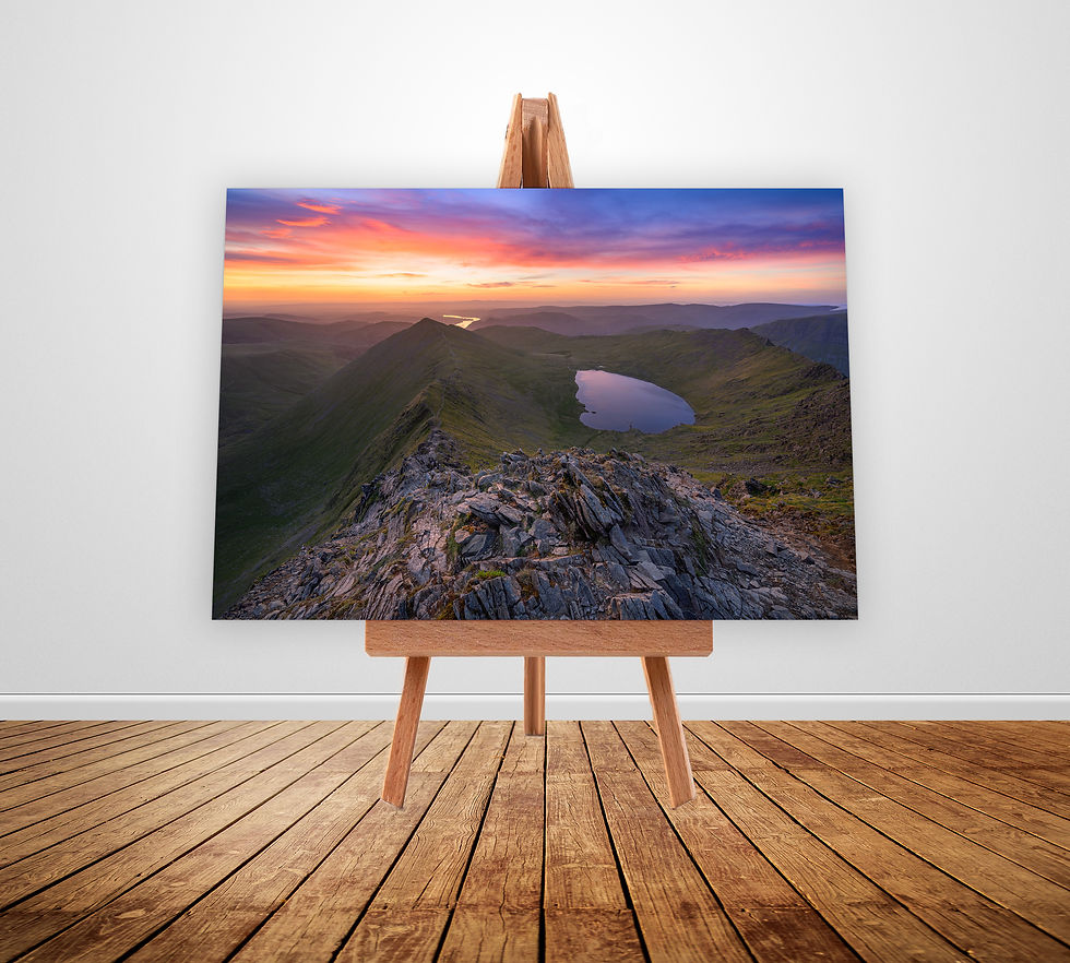 A breathtaking view overlooking Swirral Edge, Red Tarn & Ullswater, seen from Helvellyn at sunrise in The Lake District.