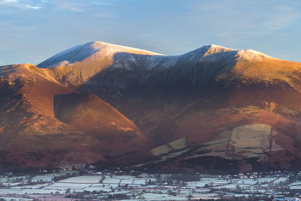 Thumbnail: crisp winter views of Skiddaw mountain range above Keswick in The Lake District, UK.