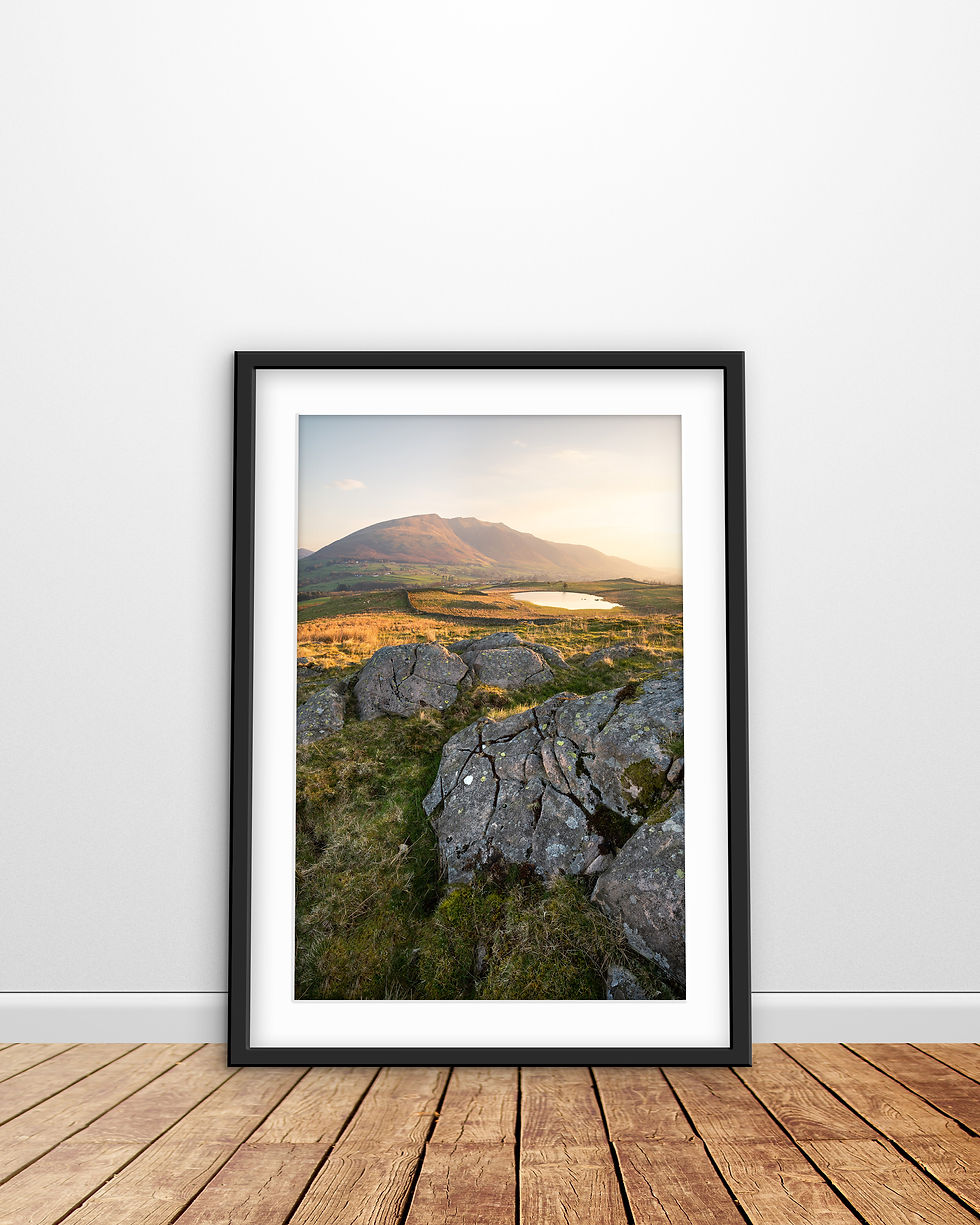Thumbnail: a beautiful hazy spring morning with golden sunshine at Tewet Tarn with breathtaking views to Blencathra in The Lake District